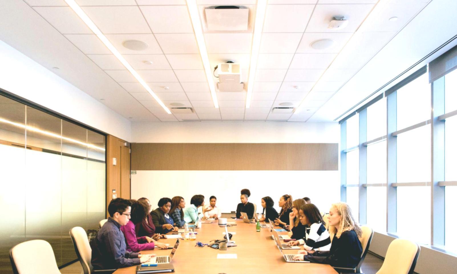 Close-up of hands working on budget calculations with financial reports