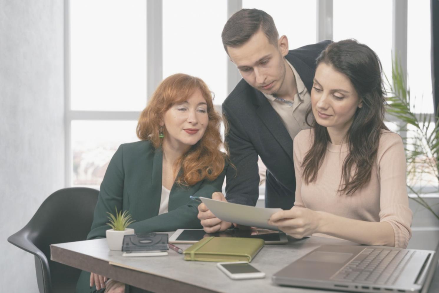 Financial professionals reviewing budget allocation strategies in a collaborative workshop setting